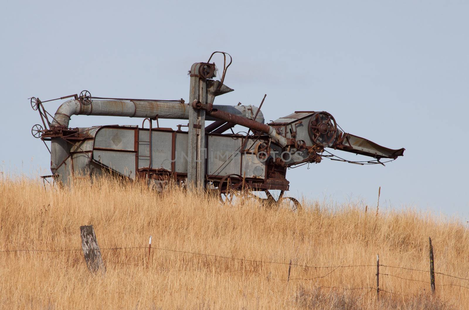 Old Rusty Combine near an old ghost town.