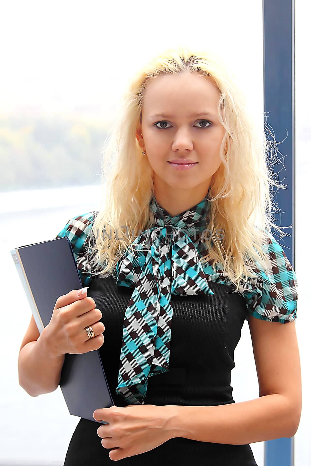 Portrait of the beautiful and young business woman