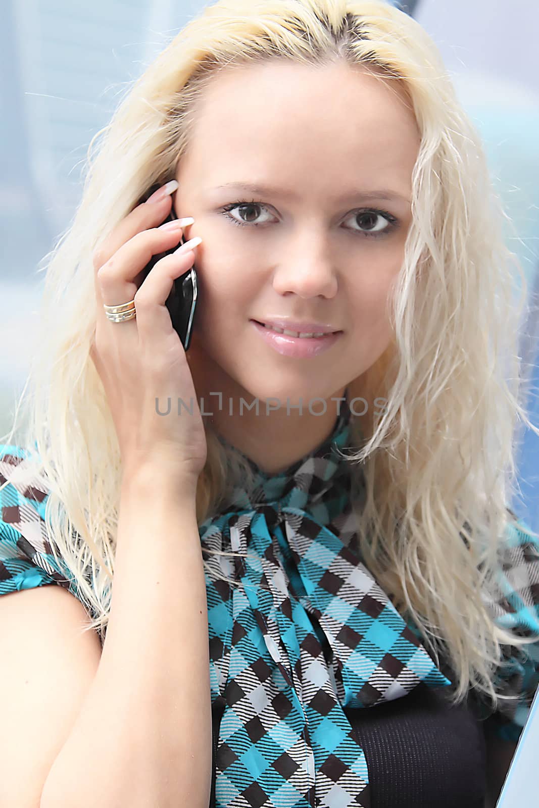 Portrait of the beautiful and young business woman
