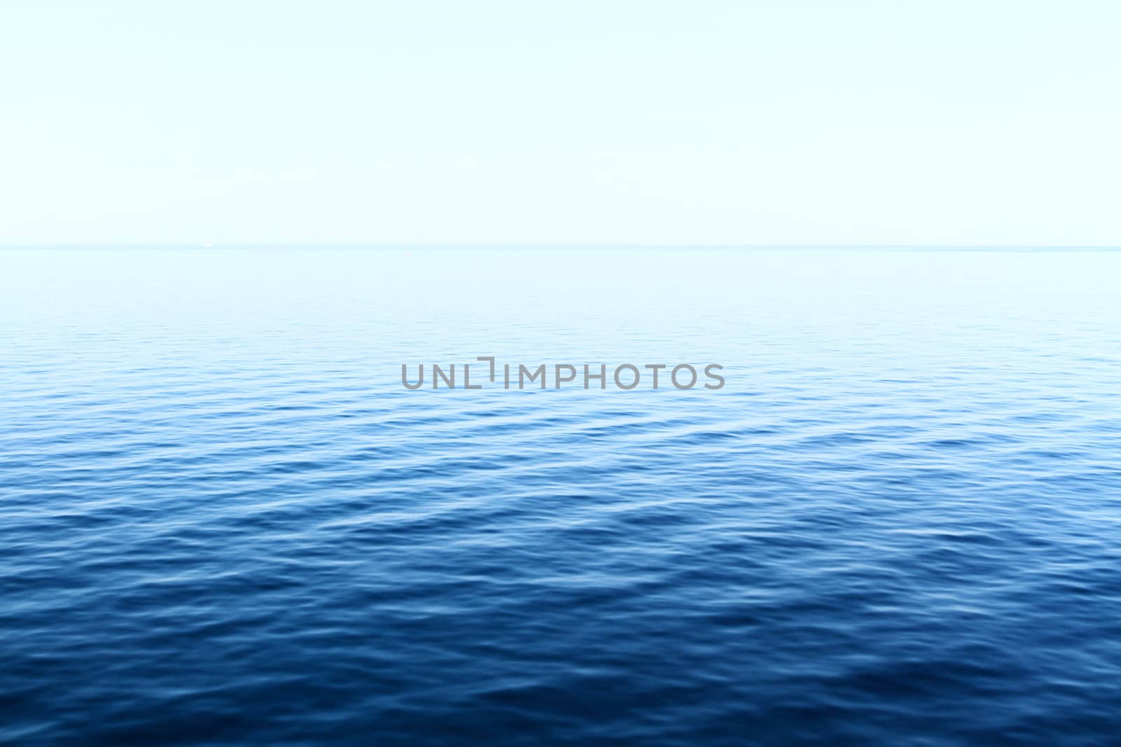 Photo of blue water background with ripples