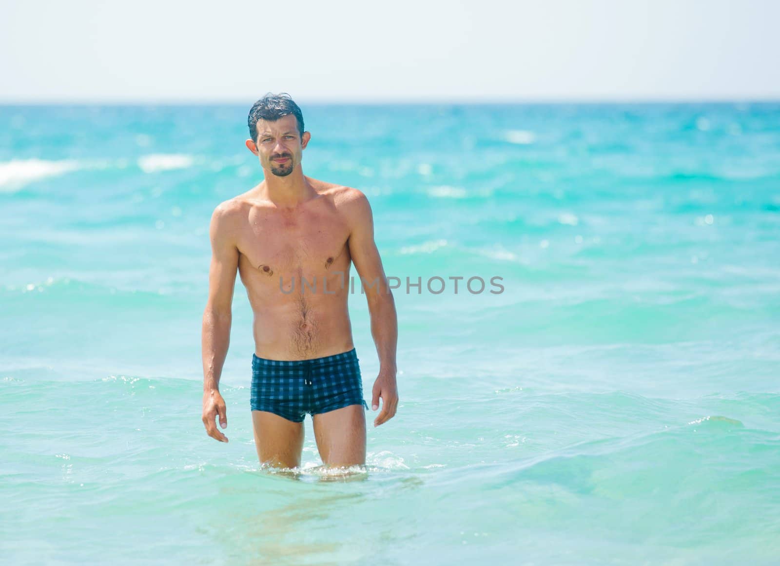Happy Swimming. Cute adult men in the water.