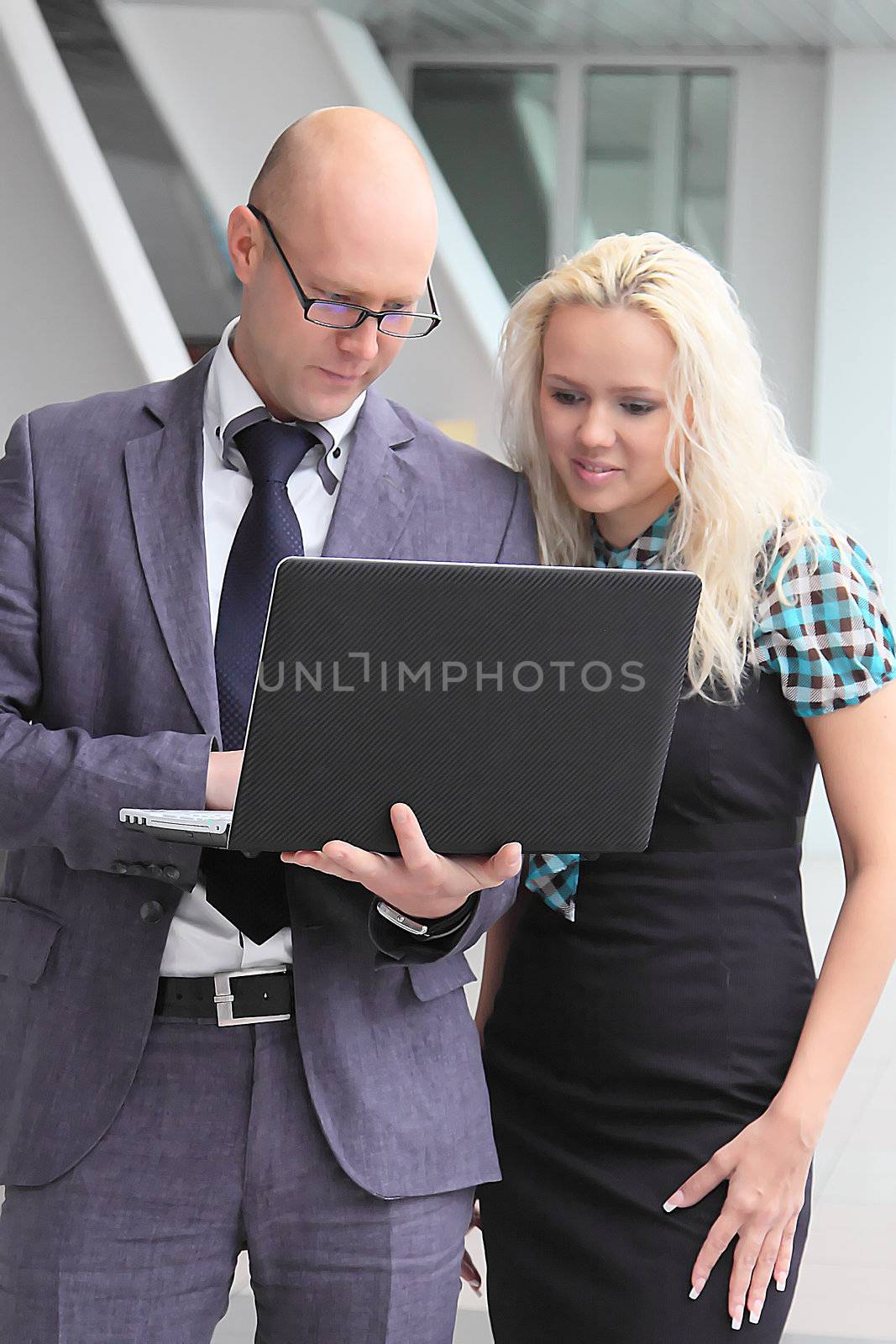 Business man and the woman discuss the project