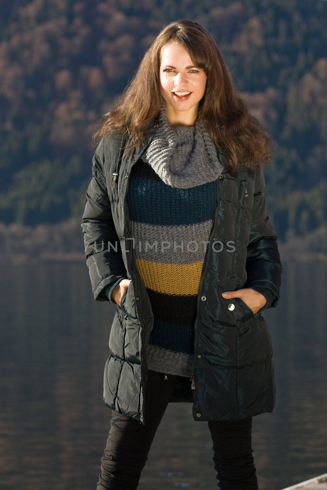 Model with the latest fashion this fall with lake in background