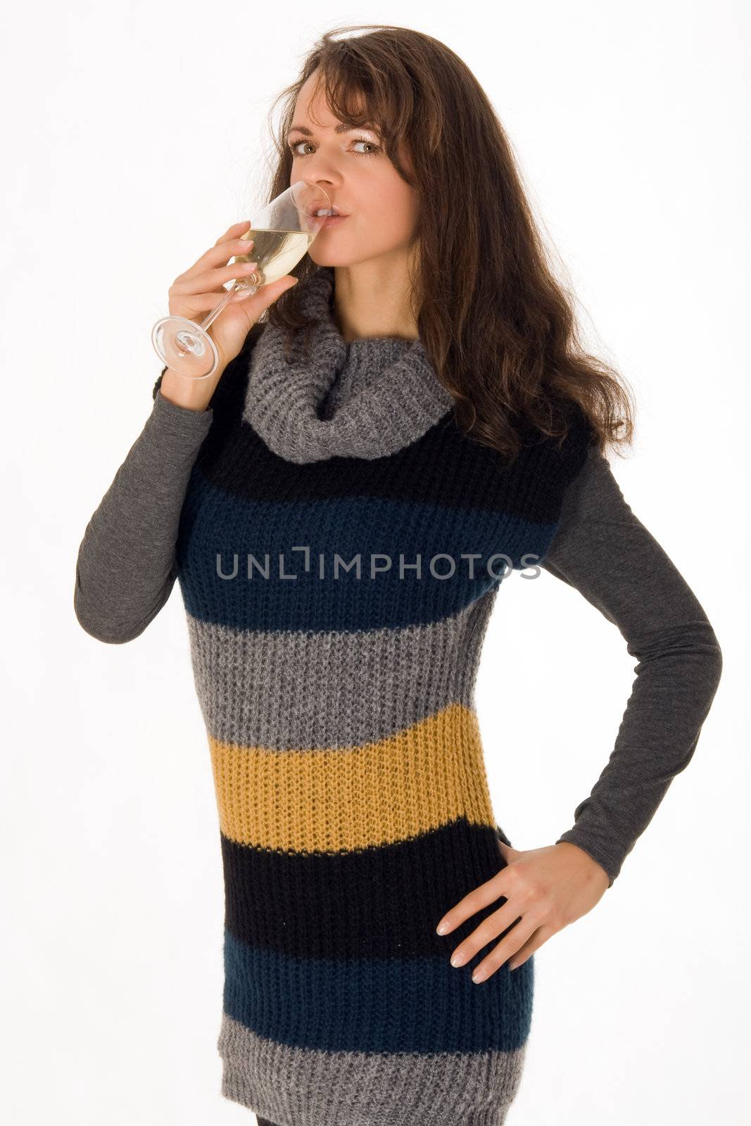 Elegant young woman drinking a glass of champagne