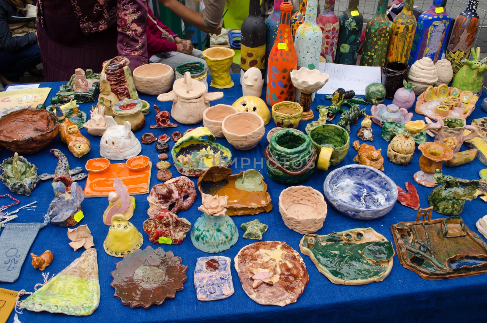 variuous clay crockery kid handmade craft wares sold in outdoor street fair market.