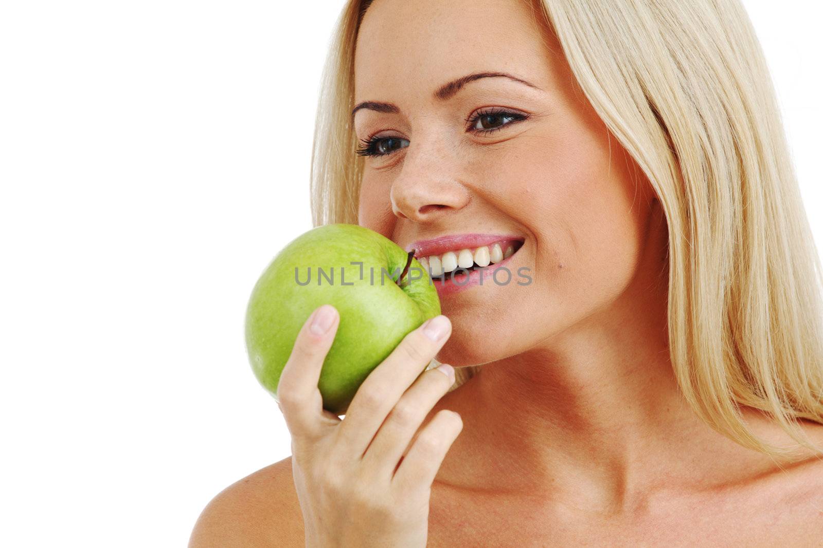 blond woman eat green apple on white