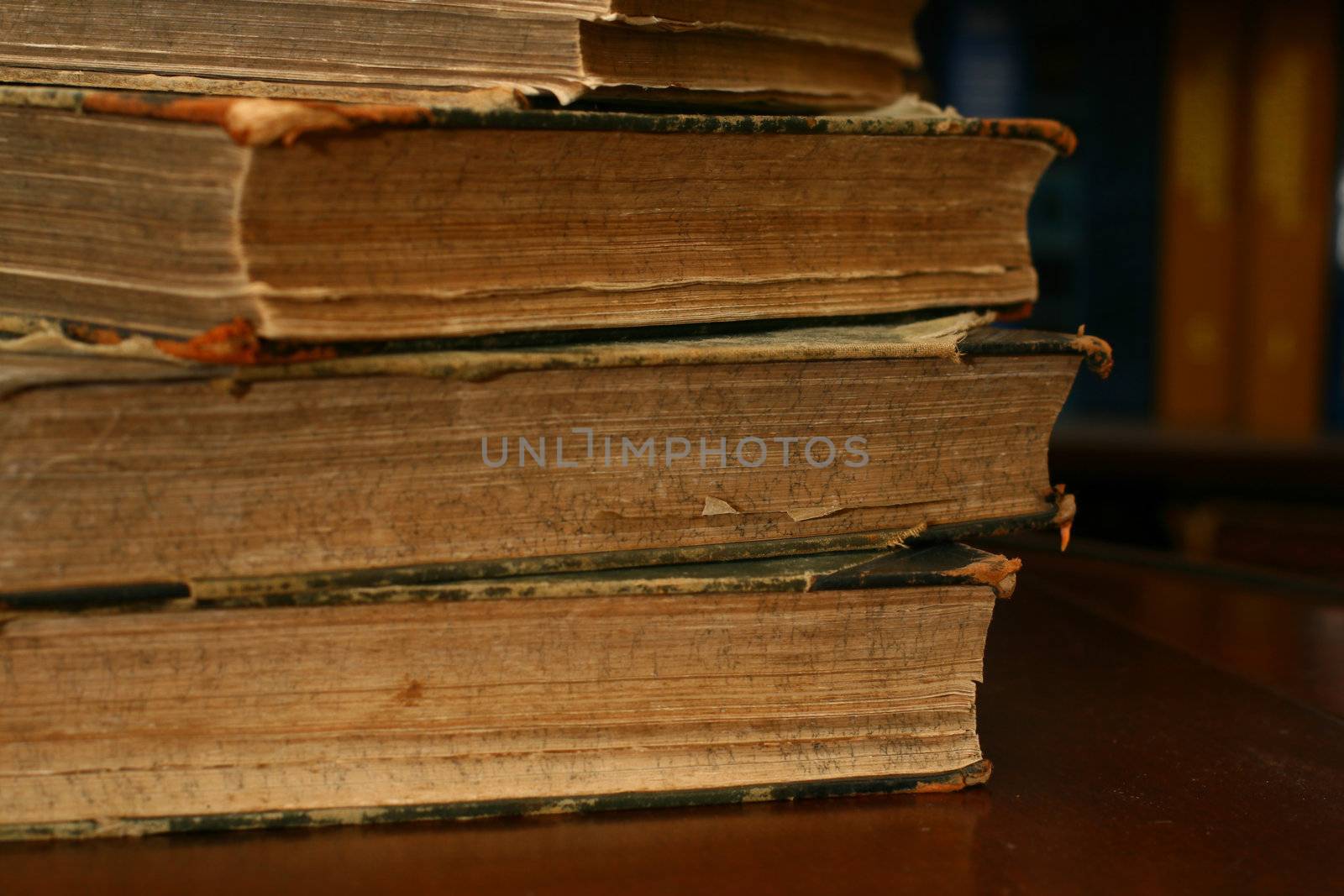 books on table in dark library room