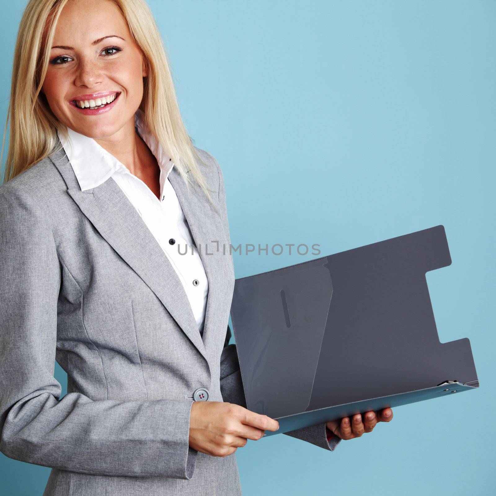  business woman hold a folder of papers on a blue background