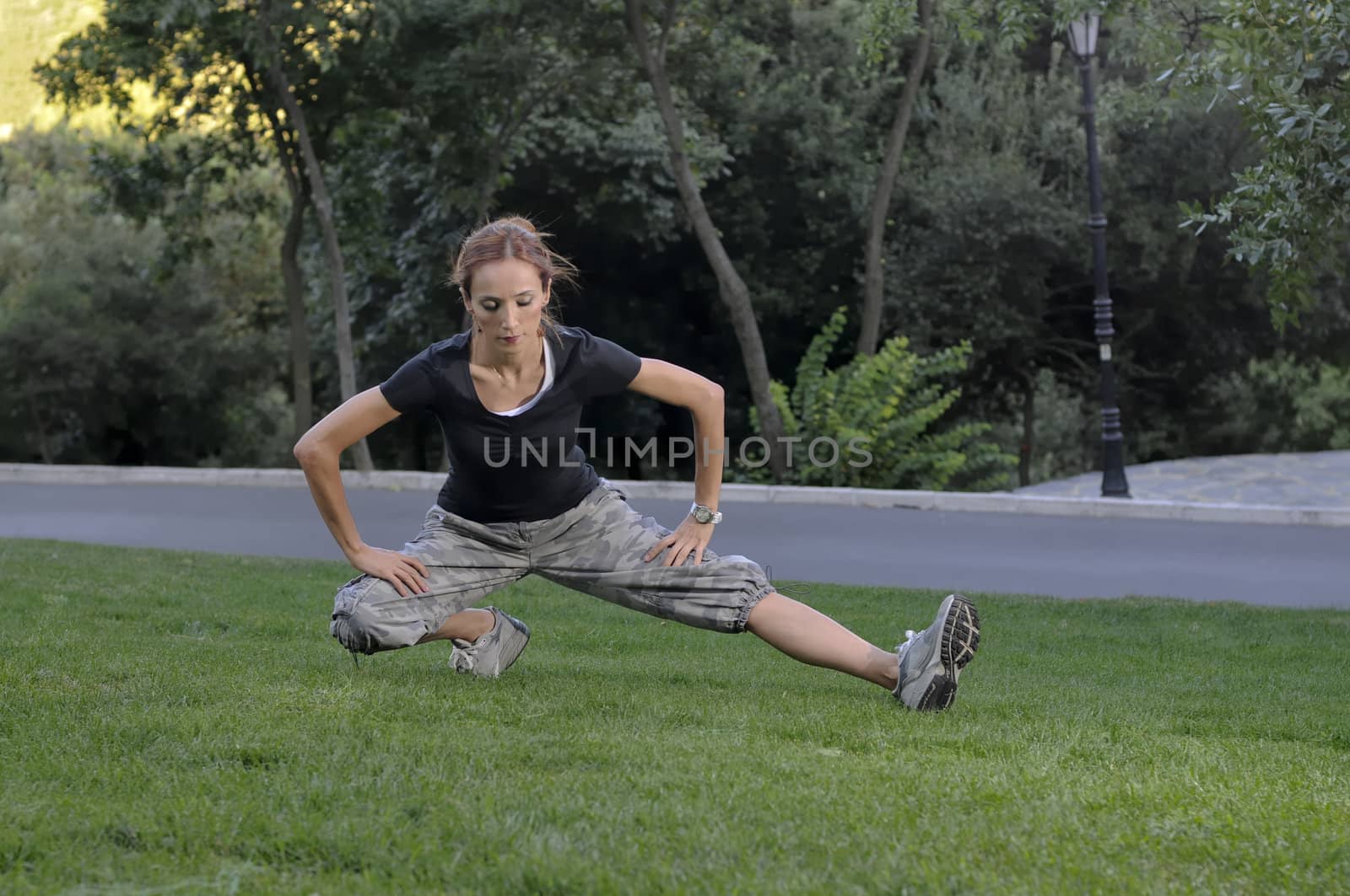 Trainer stretching in forest