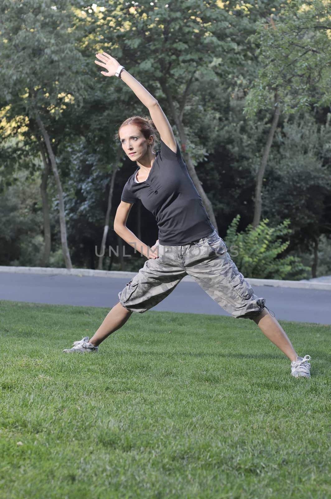 Trainer stretching in forest