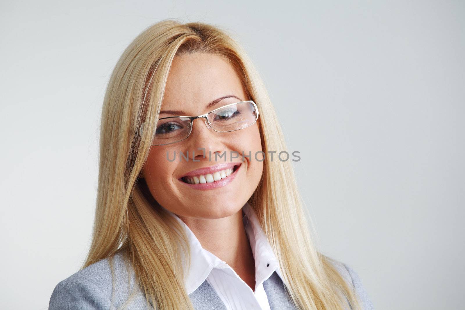 business woman in glasses on gray background