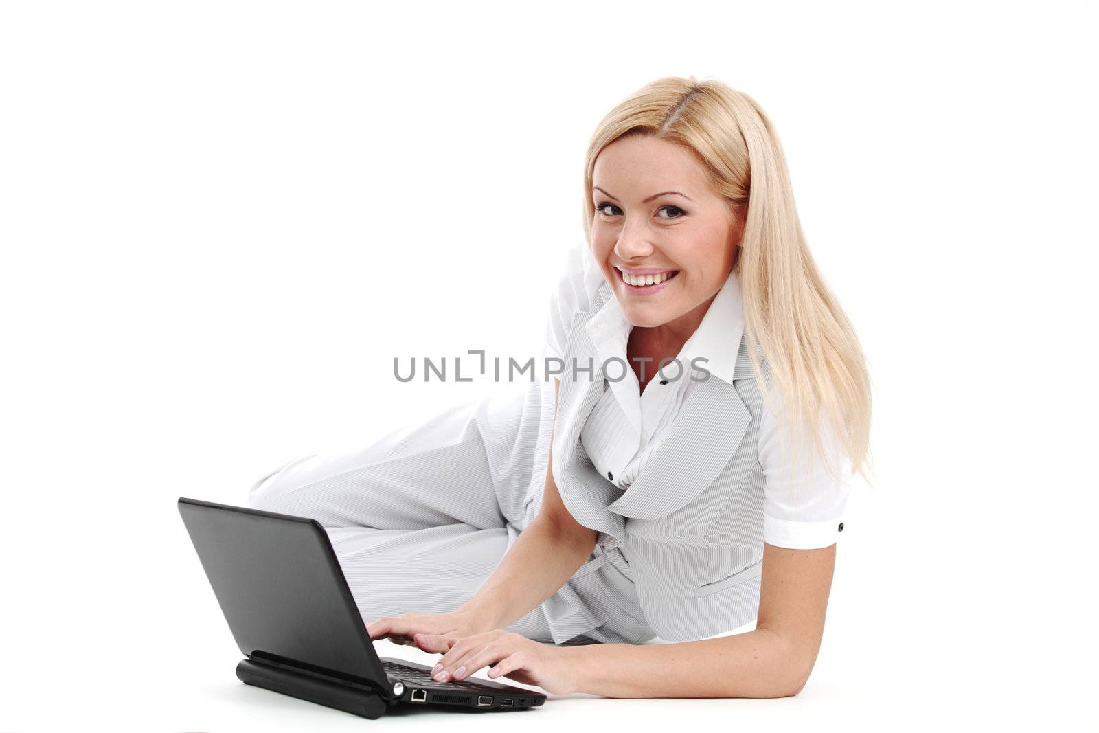 business woman lies and working on laptop