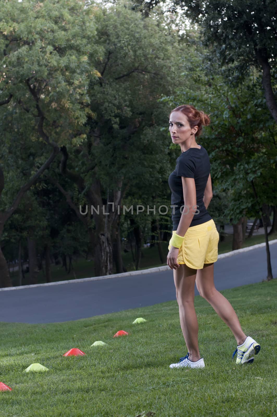 Fitness trainer in park by celaler