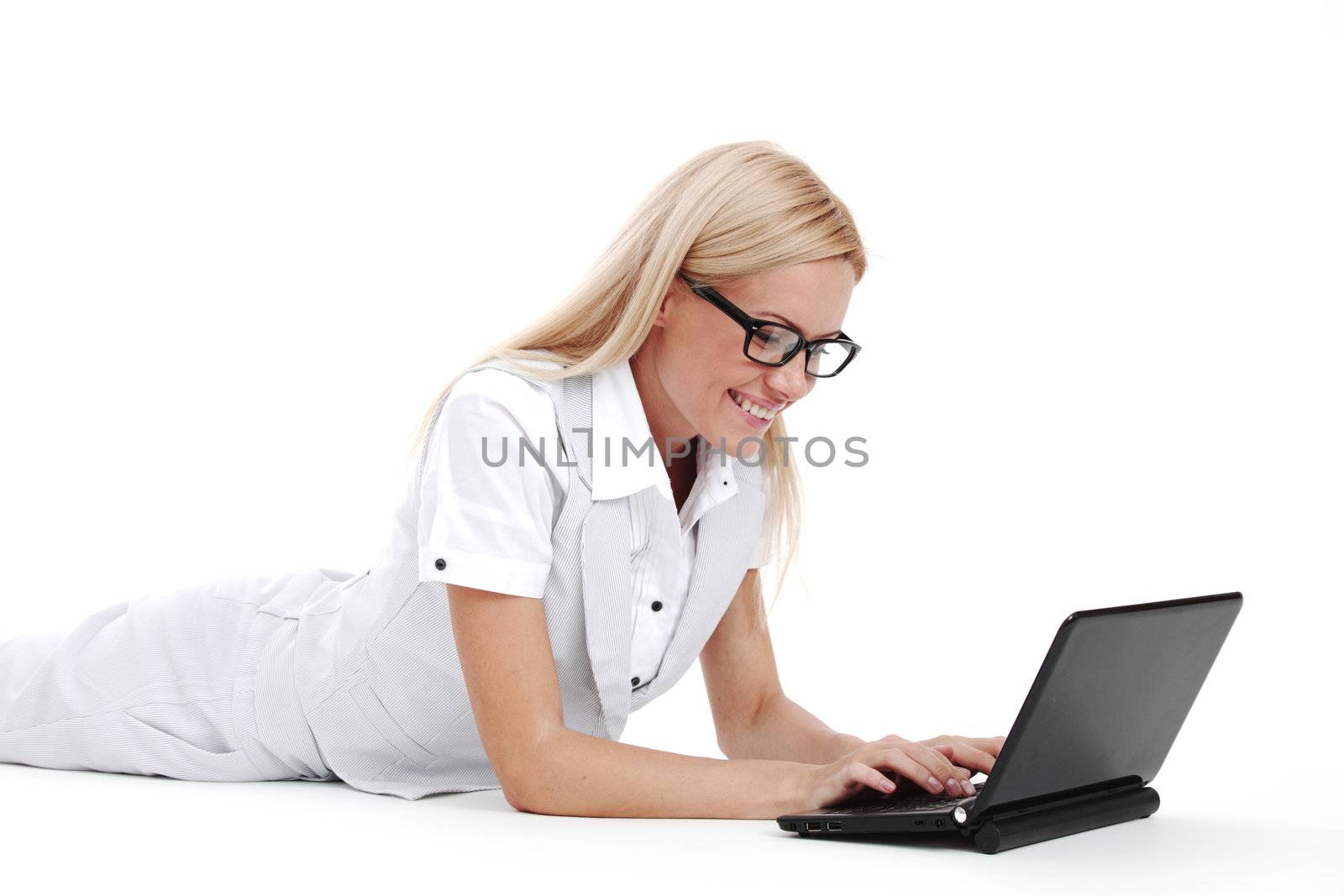 business woman lies and working on laptop