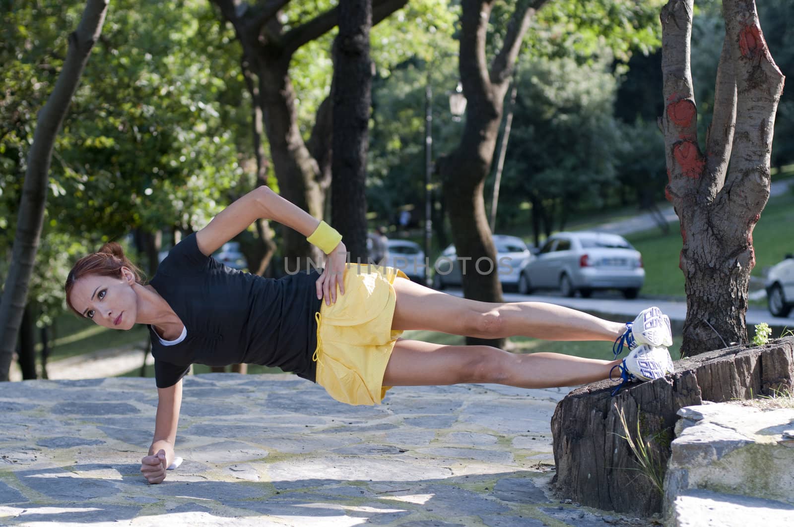 Trainer stretching in forest