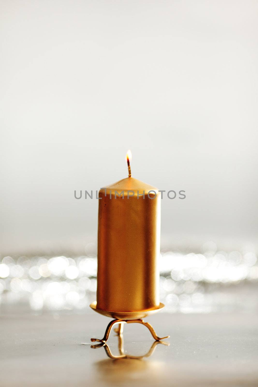  christmas candle close up on bokeh background