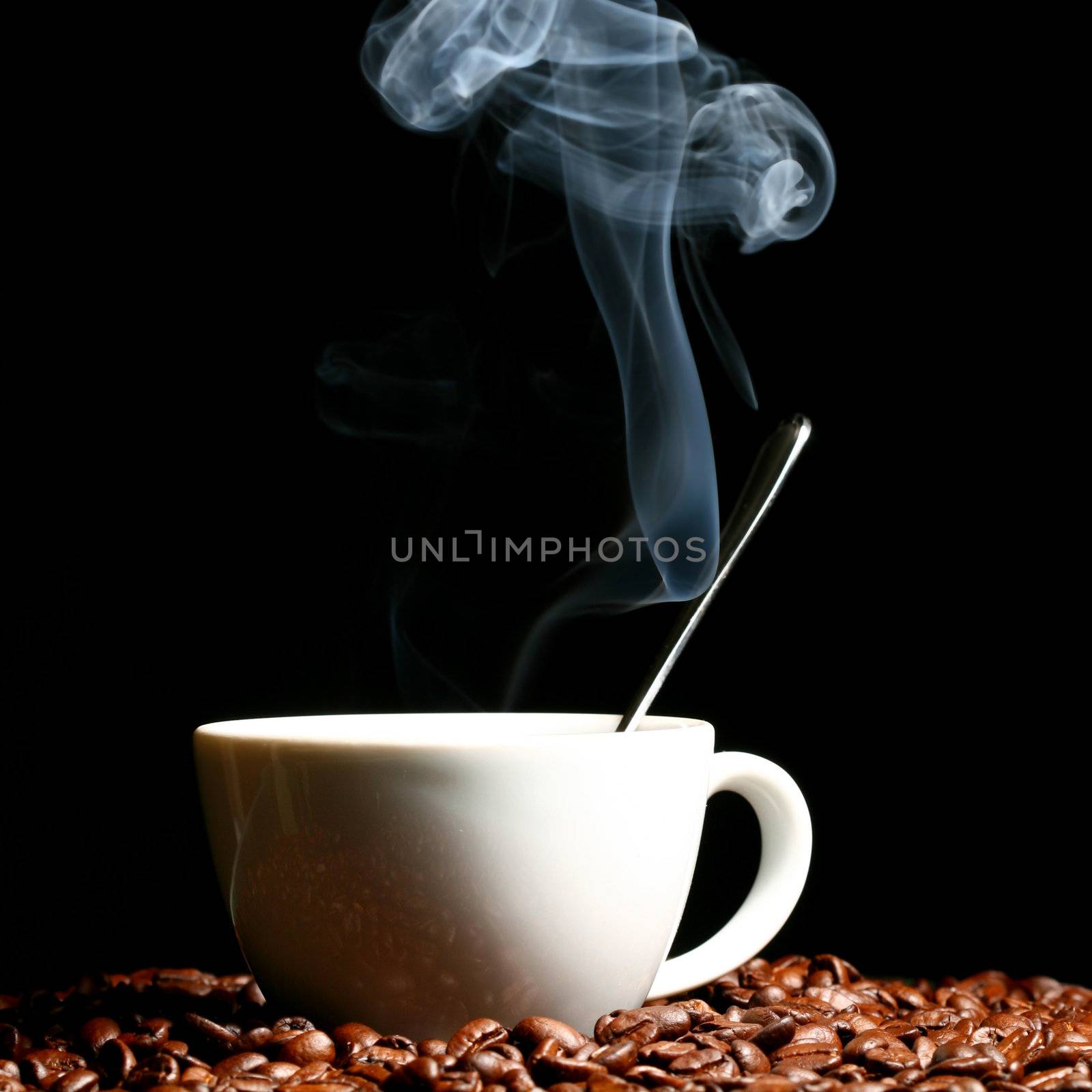 coffee beans and white hot cup of drink