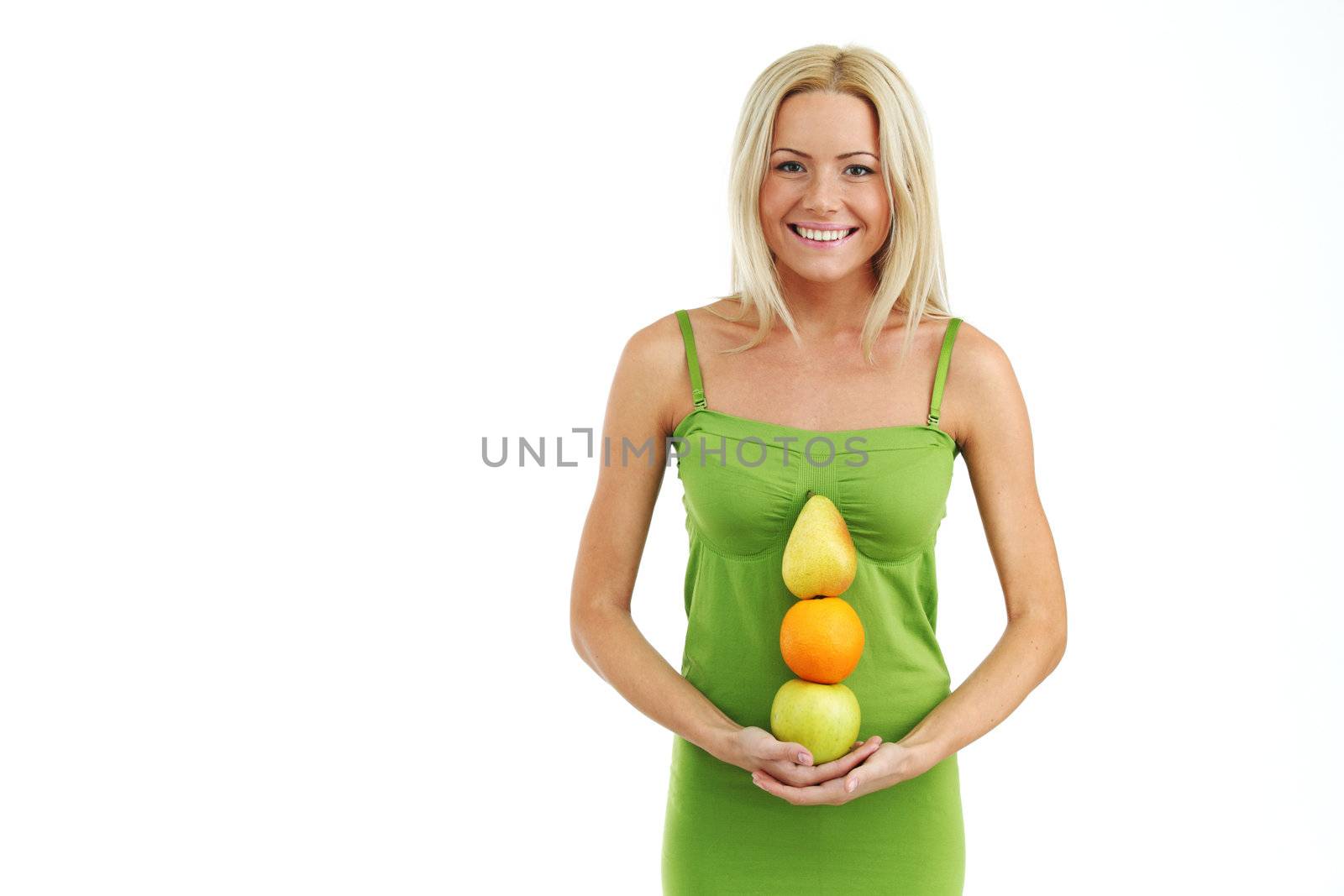 fruit pile in woman hands on white