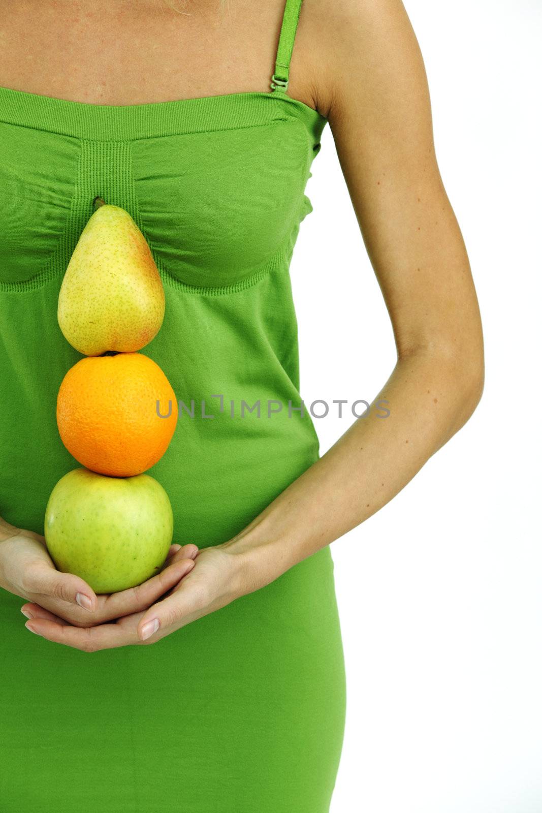 fruit pile in woman hands on white