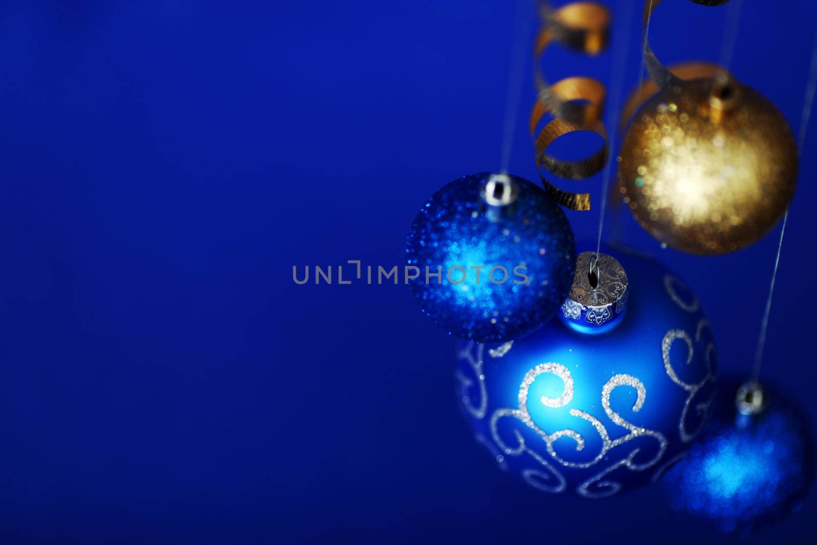 christmas balls on blue satin background