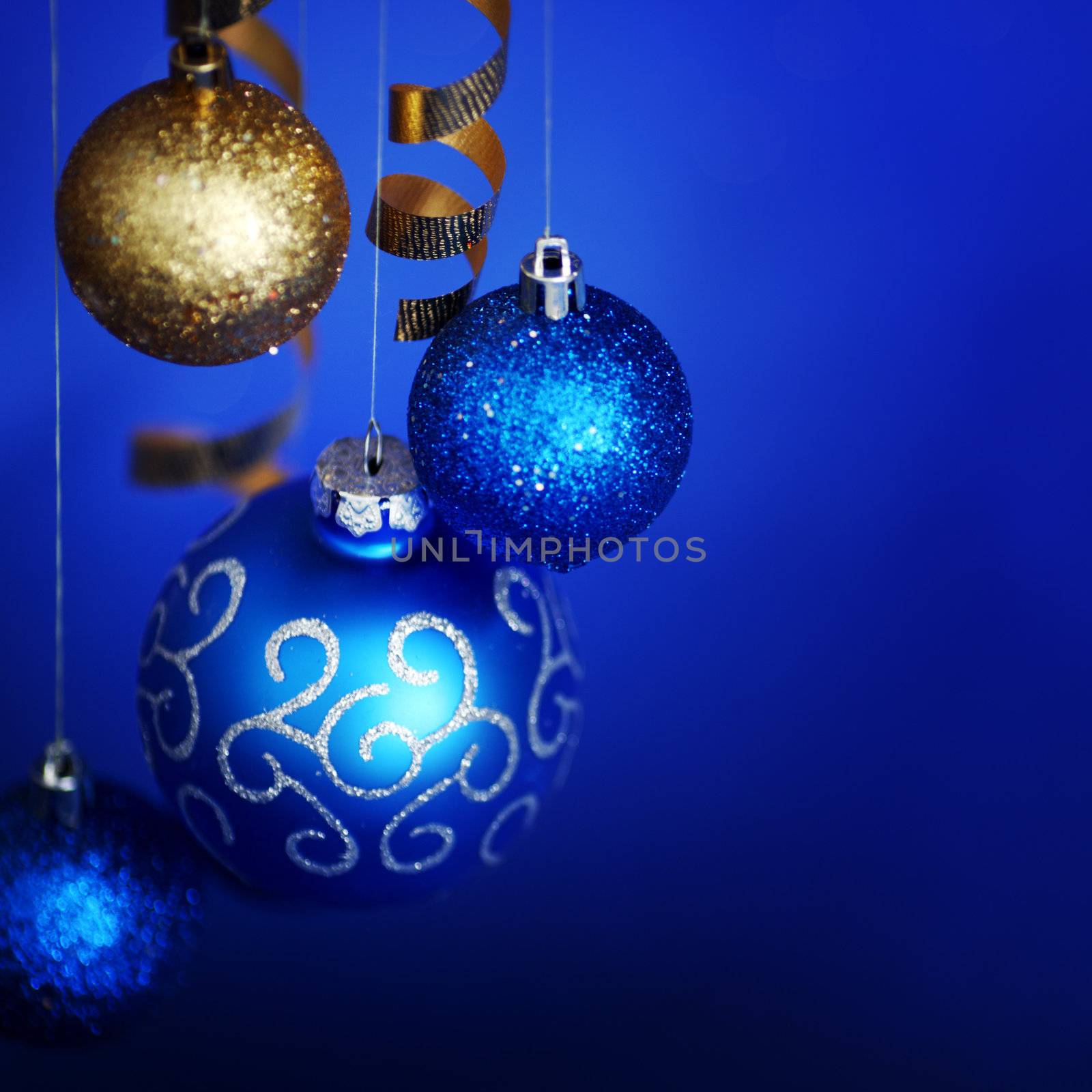 christmas balls on blue satin background