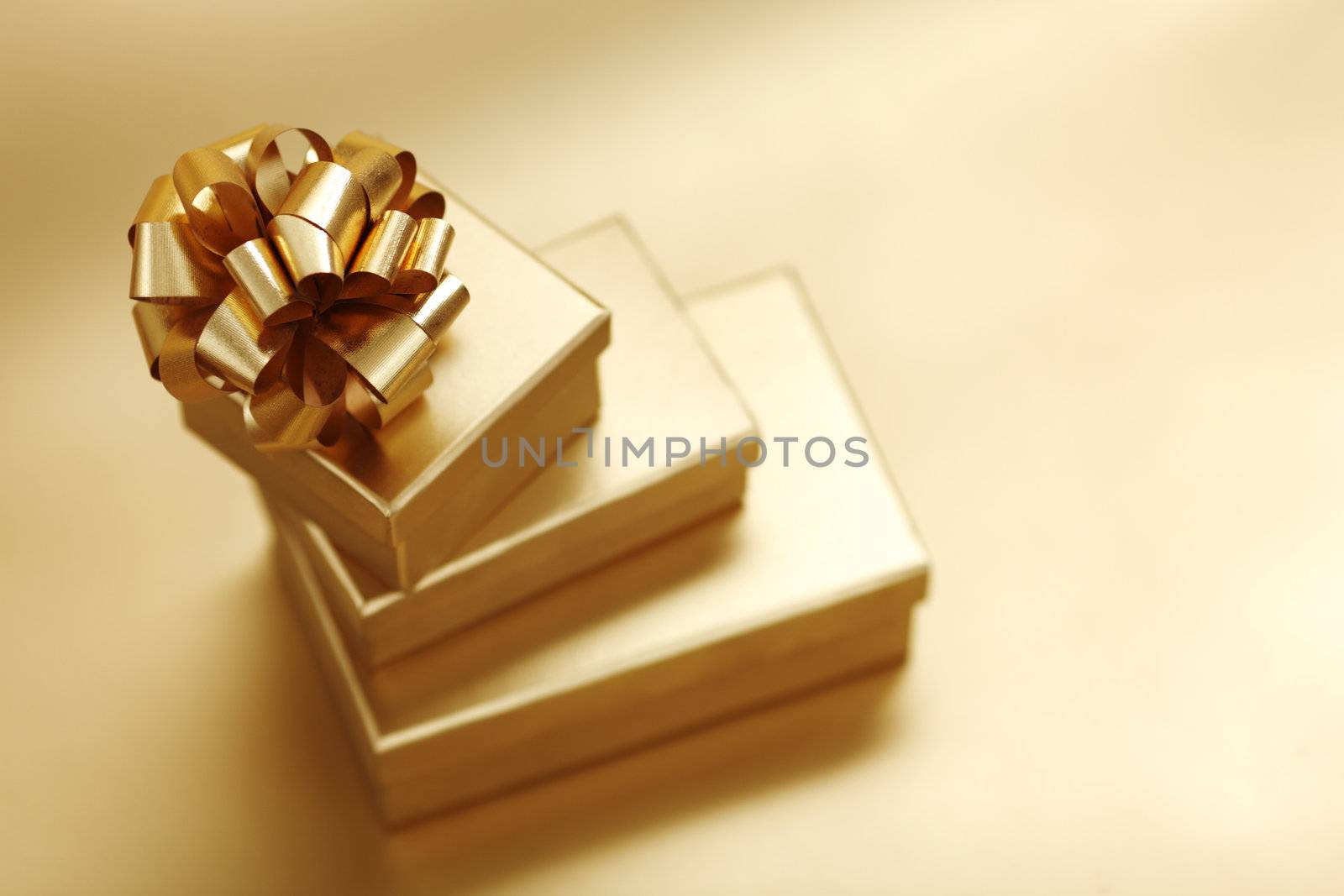 golden christmas gifts on gold background 
