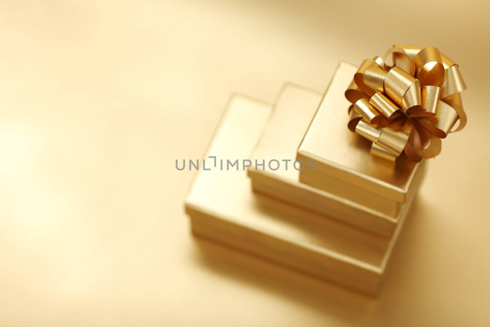 golden christmas gifts on gold background 