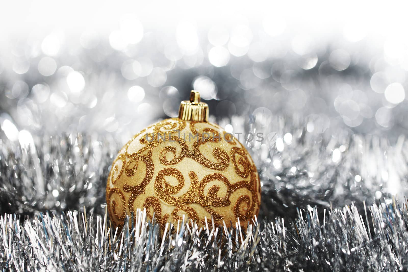  golden christmas ball on silver background