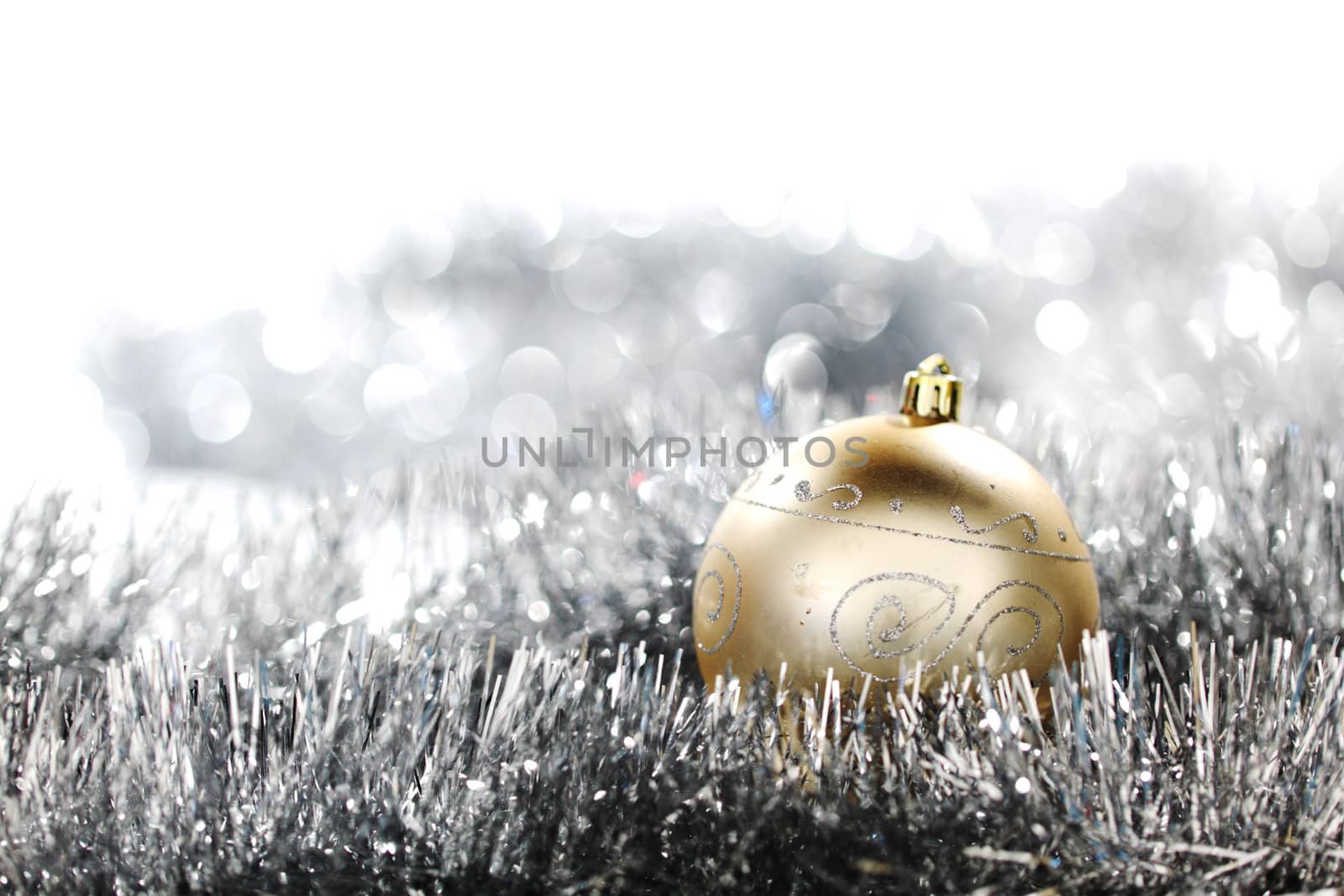  golden christmas ball on silver background