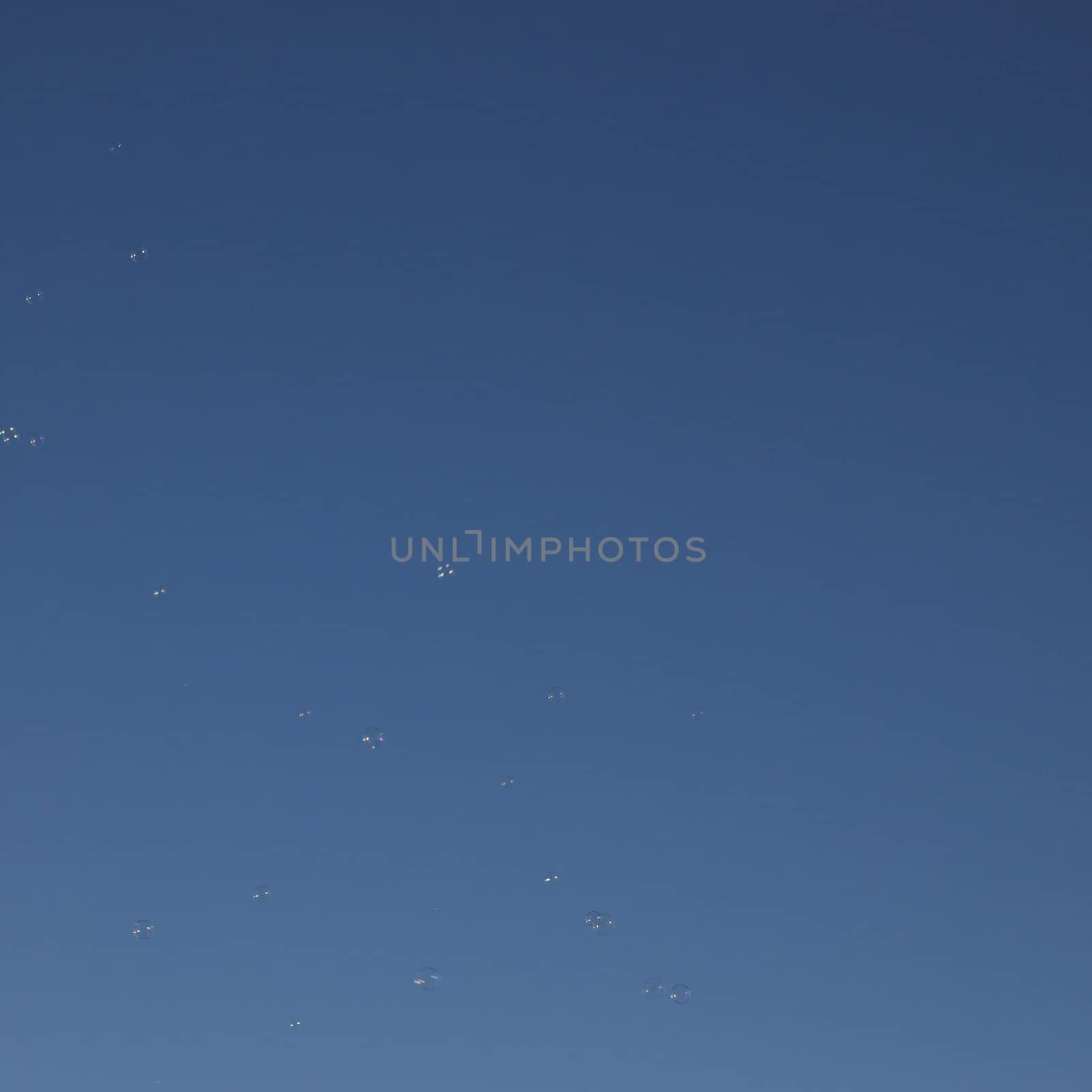 Soap bubbles in the blue sky