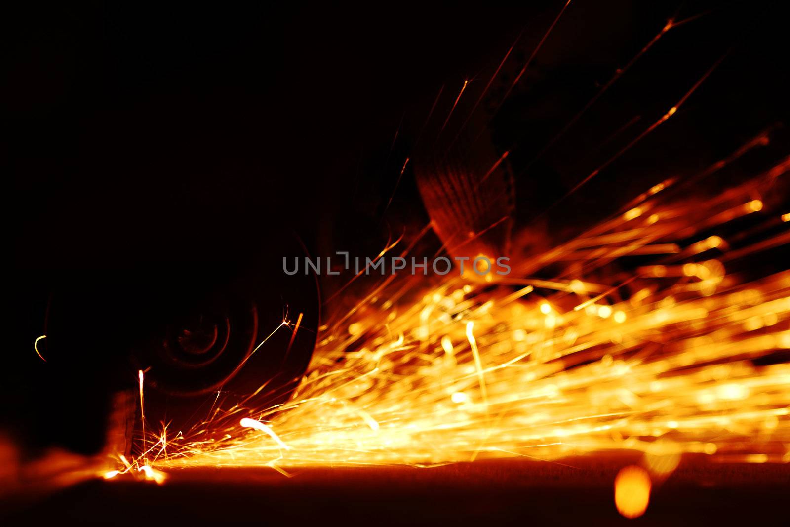metal sawing close up sparks spray