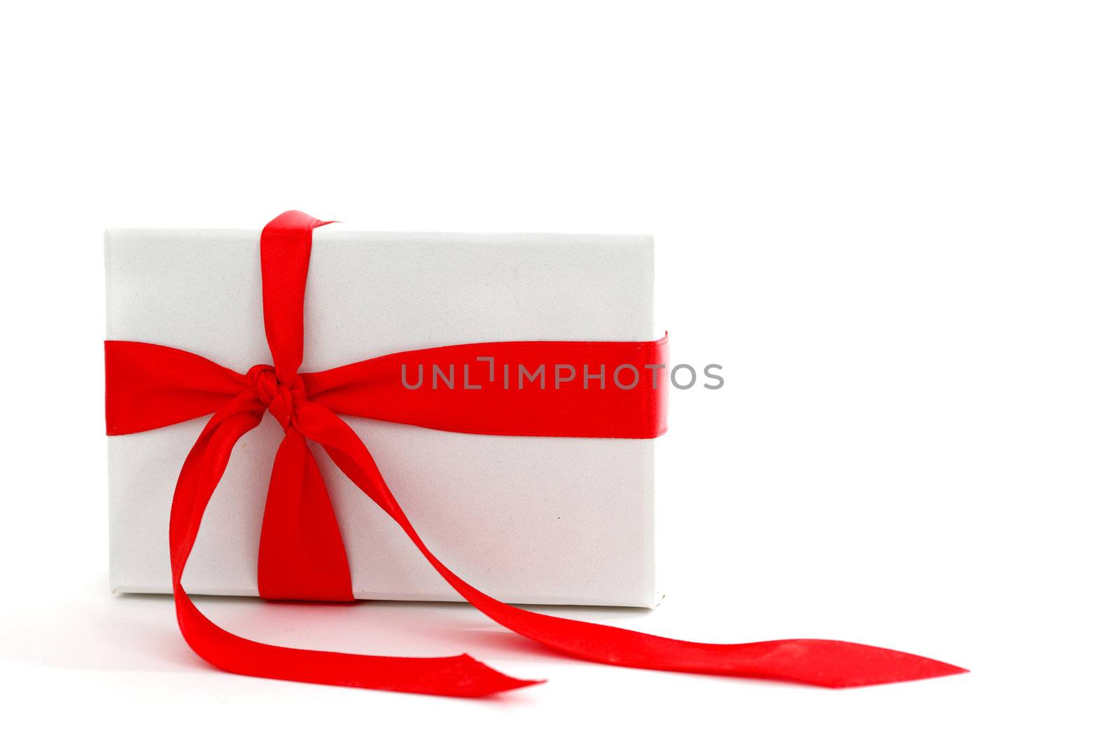 white christmas gift with red ribbon
