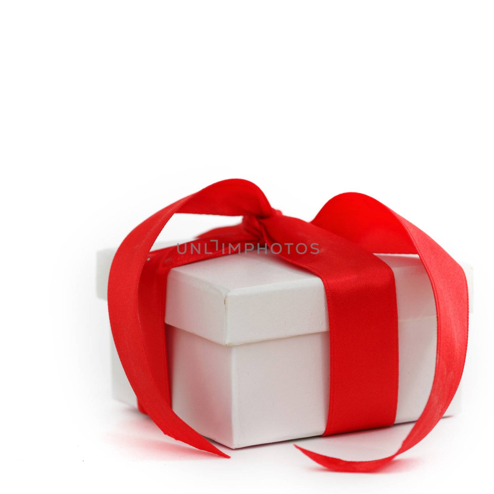 white christmas gift with red ribbon