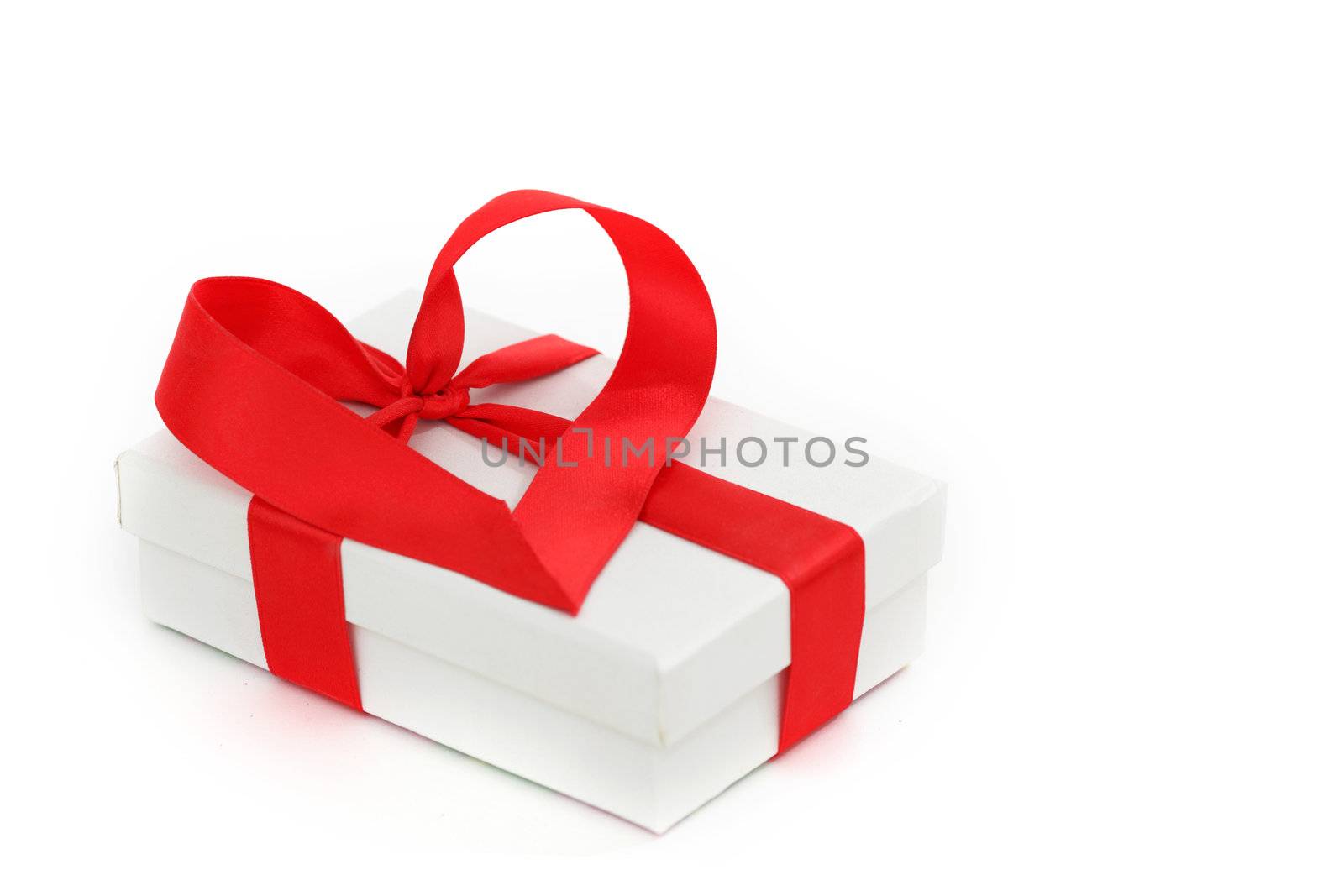  white christmas gift with red heart ribbon