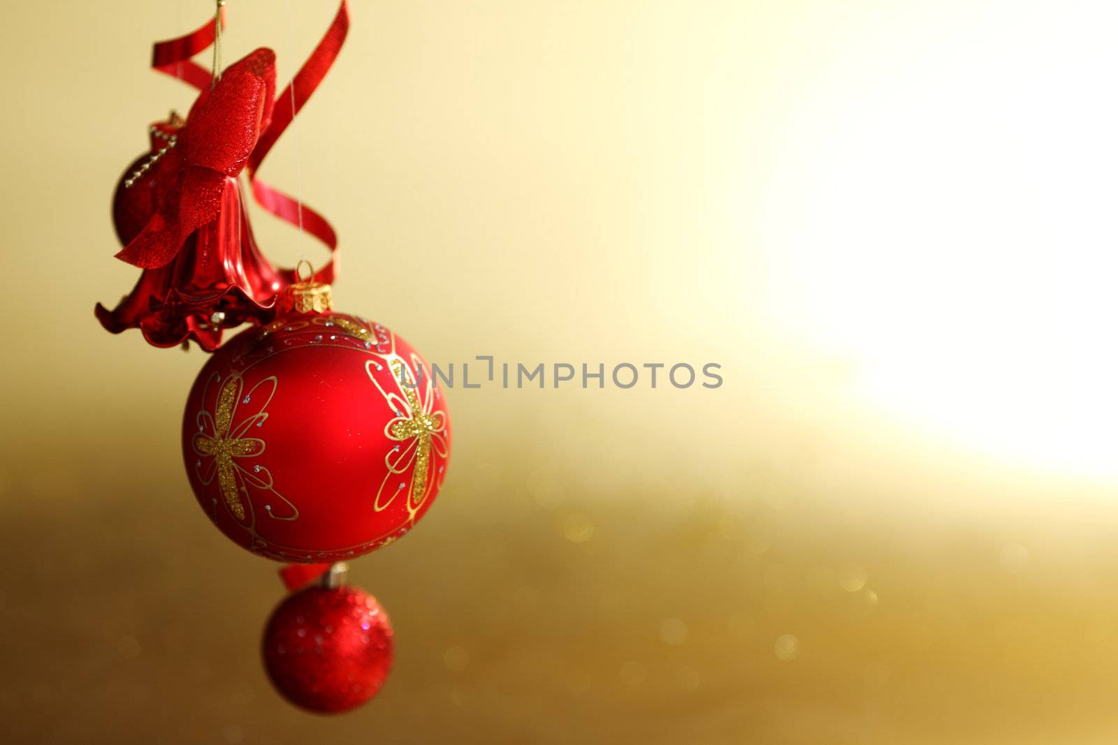  red christmas balls on gold  background