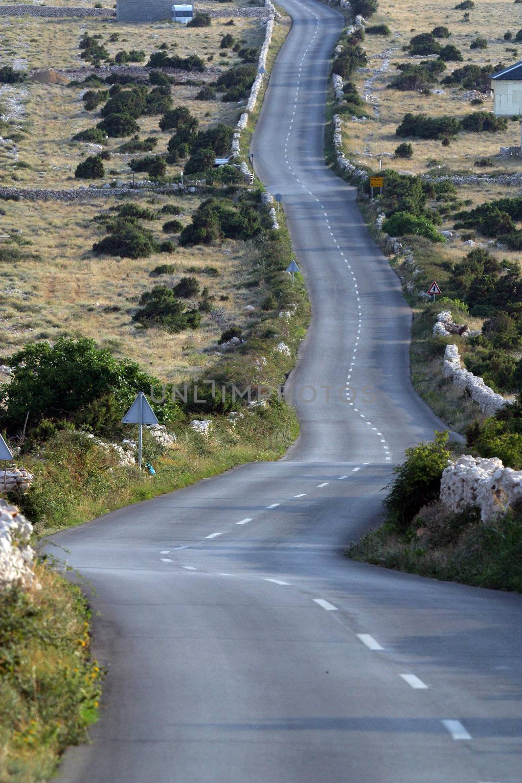 Asphalt winding road, Island of Pag, Croatia.