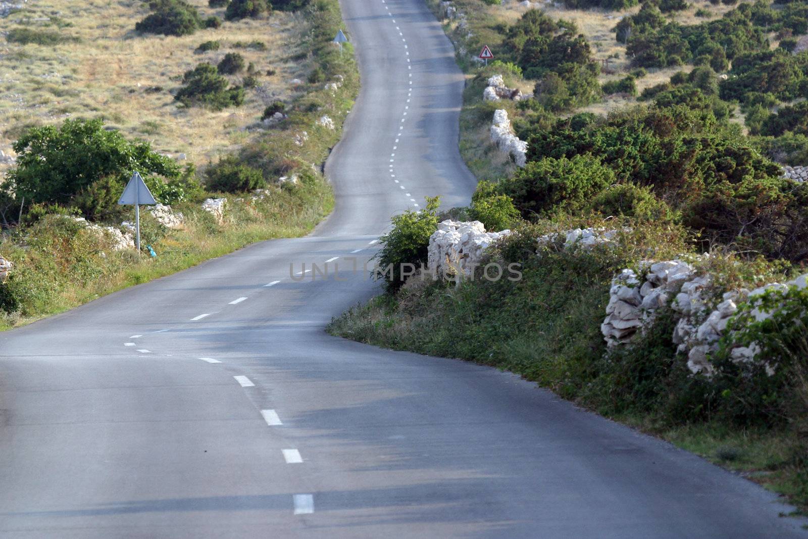 Asphalt winding road, Island of Pag, Croatia.