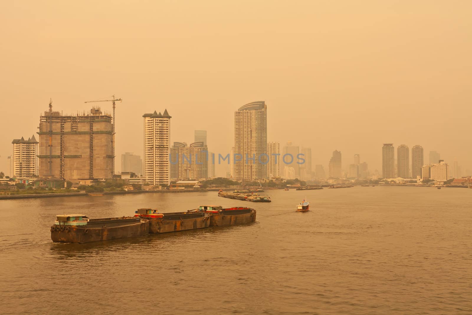 Chao Phraya river and city at twilight of Bangkok, Thailand
