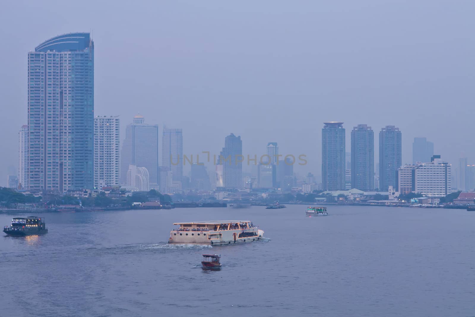 Chao Phraya river and city at twilight of Bangkok, Thailand
