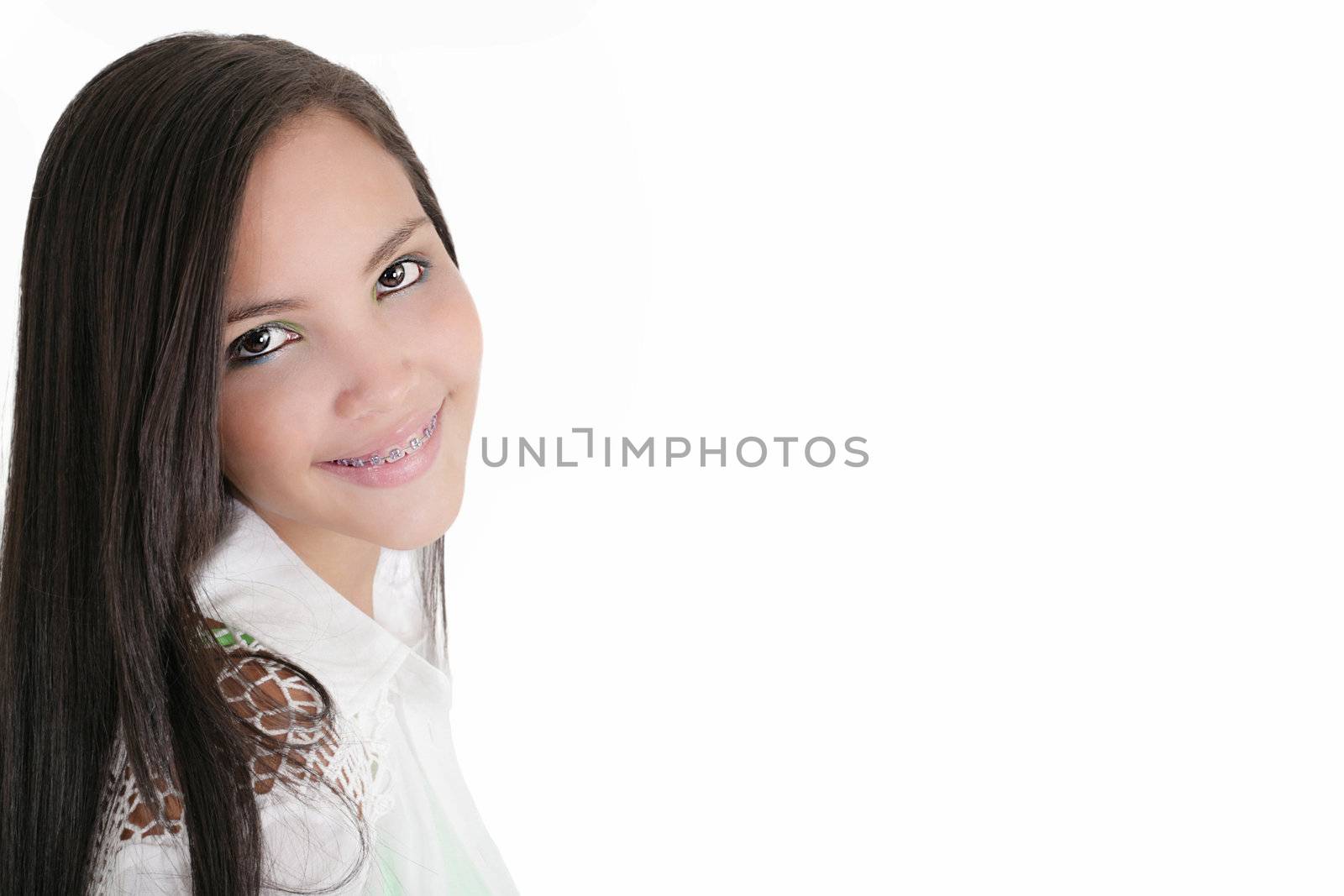 Cute Latina teenage girl smiling with braces on a white backgrou by dacasdo
