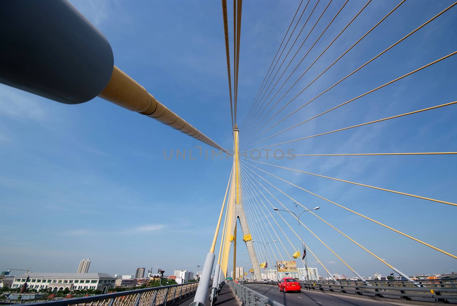 The red car was driving on the bridge, Rama 8, Bangkok, Thailand 