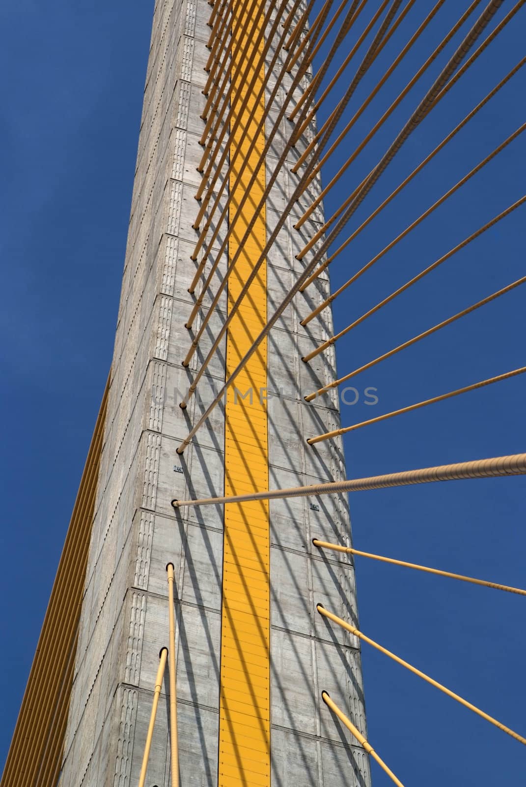 Detail of bridge construction over blue sky  by opasstudio