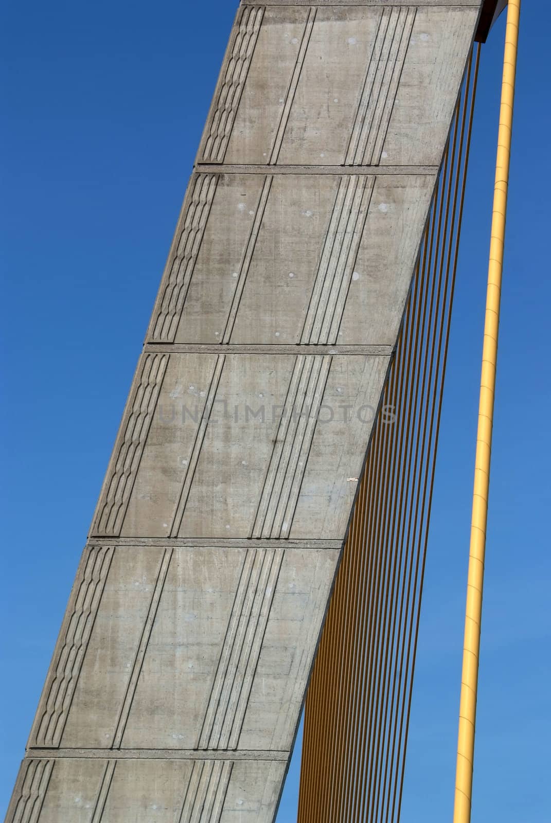 Detail of bridge construction over blue sky  by opasstudio