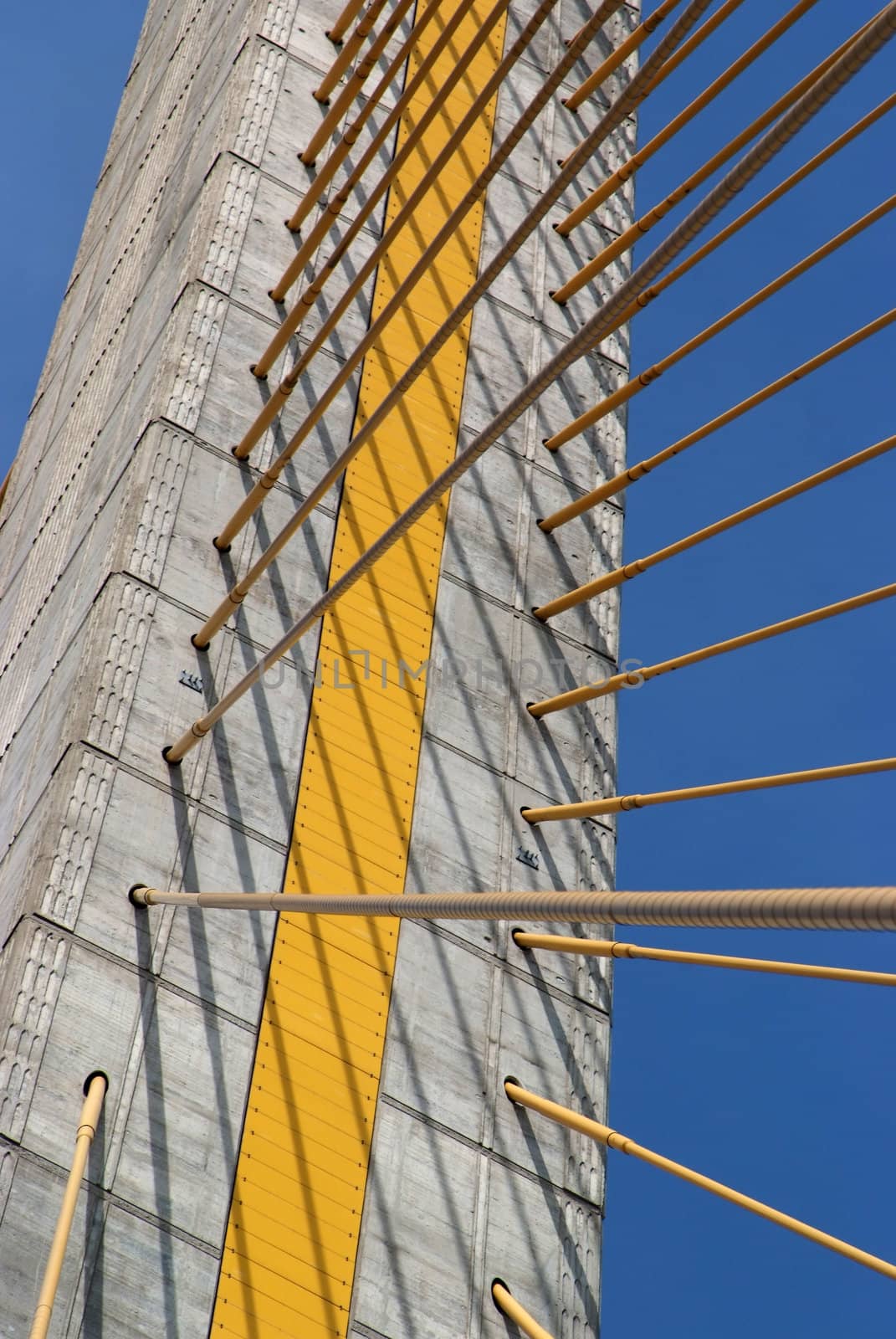 Detail of bridge construction over blue sky  by opasstudio