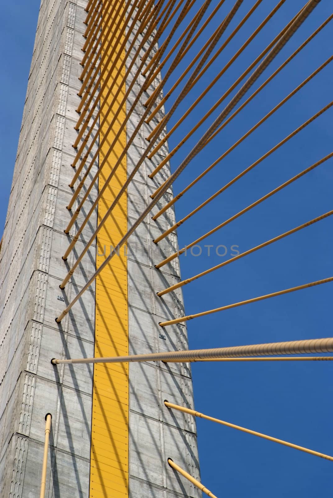 Detail of bridge construction over blue sky  by opasstudio