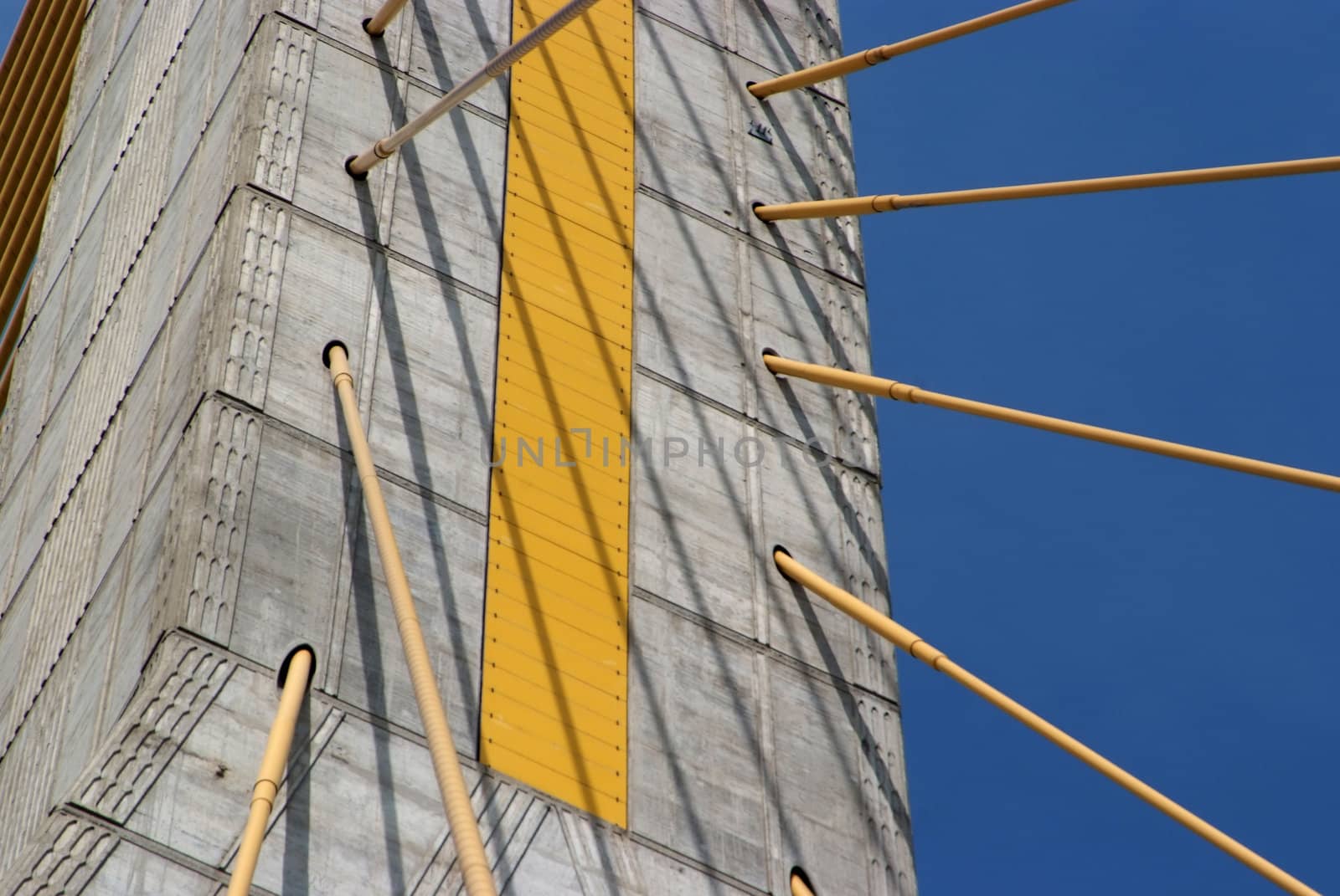 Detail of bridge construction over blue sky  by opasstudio