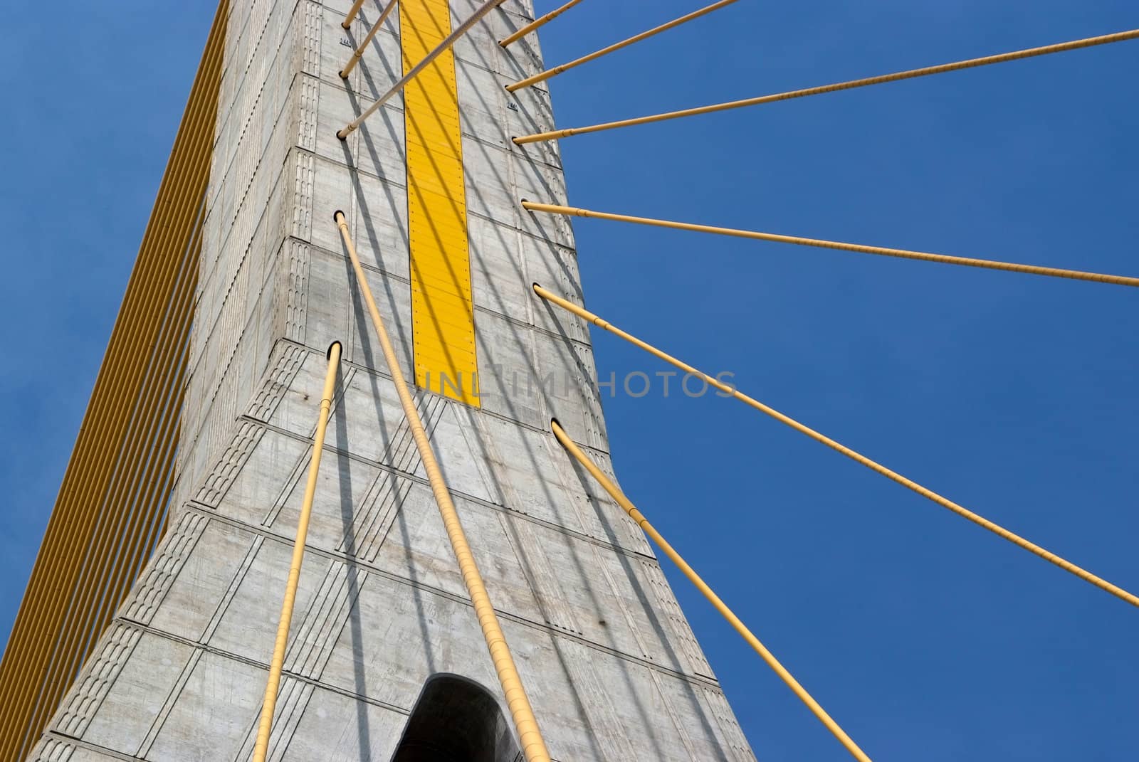 Detail of bridge construction over blue sky  by opasstudio