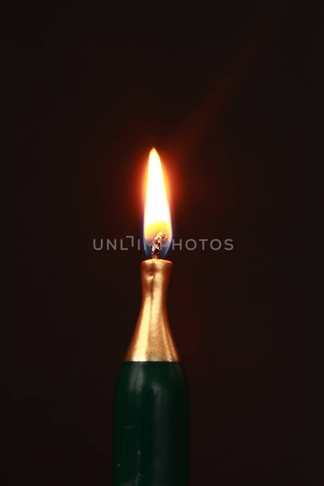 a lit bottle shaped candle