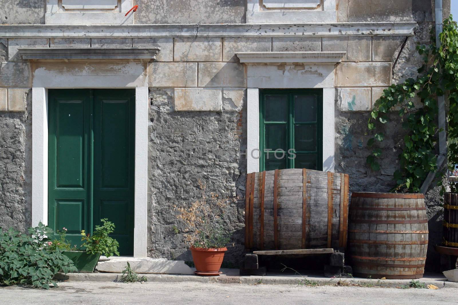 Barrels in front of house