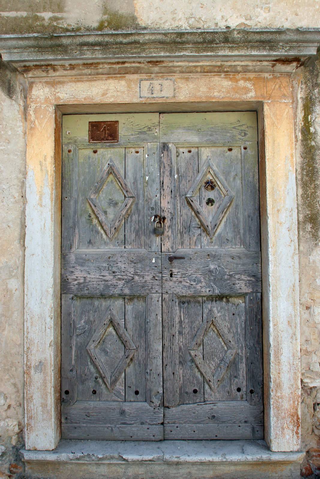 An old wood door with metal handle